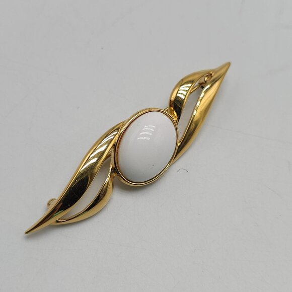 Monet Gold Tone Brooch With White Cabochon Oval Center Abstract Design - Picture 2 of 5